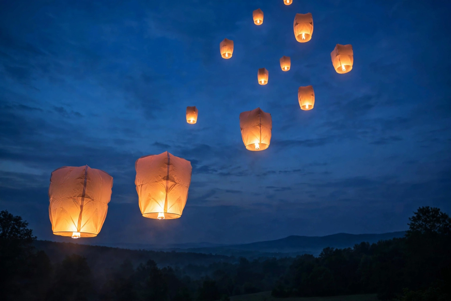 Paper lanterns rising into a twilight sky, a symbol of hope and remembrance for Suicide Prevention Awareness Month